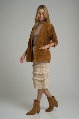 A model wearing brown suede cowboy boots