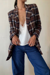 Model wears check blazer with jeans by lilya