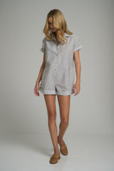 A model wearing a blue striped cotton playsuit