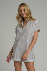 A model wearing a casual loose-fit playsuit