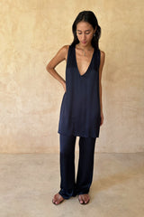 Model wears satin matching set for dinnersand events.