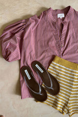 Close-up photo of the LILYA flounce blouse in a soft sunset stripe