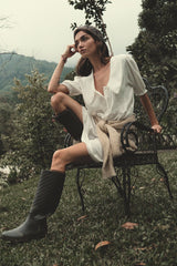 Model wears white cotton lace trim mini dress with peter pan collar