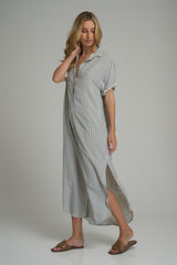 A woman wearing a Hutton Dress Cheshire Stripe Blue by LILYA