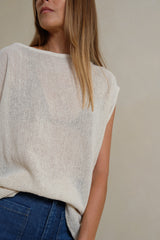 Close-up of breathable cotton mesh fabric in cream