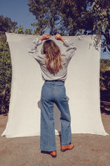 Olivia wearing the high waisted Lou Lou Jeans with the Mohave Top by LILYA.