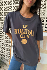 A woman wearing the LILYA oversized tee with a flocked exclusive logo