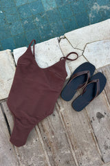 flat lay of a ribbed high cut side swimsuit in chocolate