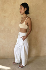 Model wearing straight leg beach pants with drawstring waist by LILYA