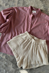 Natural cotton beach shorts with relaxed leg shape styled with sunset stripe blouse
