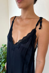 close up of adjustable strap satin midi dress