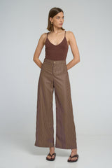 Model wearing LILYA Rio Pant in cocoa stripe cotton
