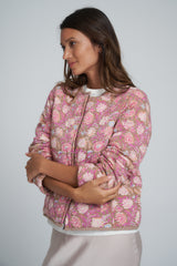 A Model Wearing a Pink/Brown Floral Winter Jacket