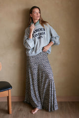 Model wears floaty floral midi skirt