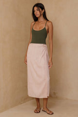 Model wearing wrap style sarong skirt