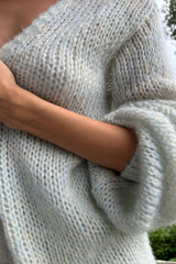 Detail photo of open weave knit cardigan. by LILYA