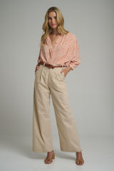 A model wearing casual beige cotton pants