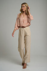 A model wearing high waisted cotton pants