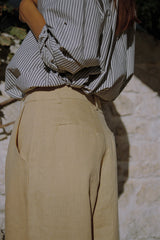 A model wearing a chai coloured linen pants