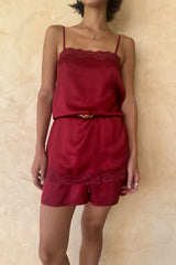 Model wearing the Lani Cami top styled with the Peregian Shorts in silky red satin as a set.
