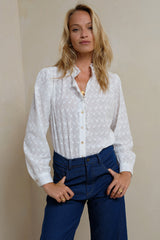 Front view of broderie anglaise blouse with buttons