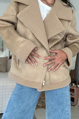 Girl styles oversized shearling jacket with side pockets and wide collar with jeans for stylish winter look