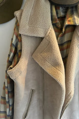 Detail shot of collar of oat shearling vest by LILYA