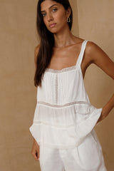 Woman wearing the Elodie relaxed ivory camisole top