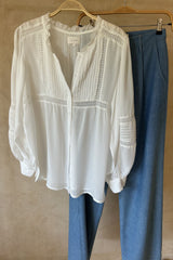 Crisp White button-up blouse with soft pleats and frill neckline