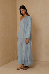 Woman wearing the Layne one-shoulder midi dress in blue green print