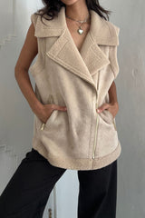 Girl wears a shearling vest in oat colourway with wide collar