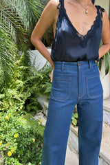 Girl wearing the Oriana siky cami top by lilya with jeans