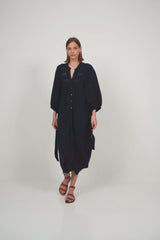 A model wearing a navy maxi dress for summer