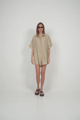 model wearing sand coloured linen playsuit summer