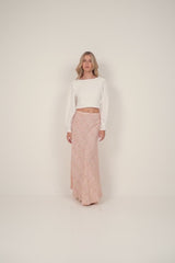 A model wearing a white rayon cropped top