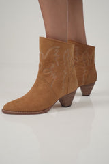 A model wearing the Canyon Boot in Chestnut by LILYA