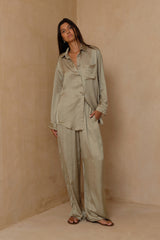 Silky satin shirt in soft sage green with curved hem