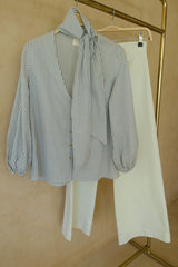 Feminine blue stripe top with gathered sleeves and relaxed drape