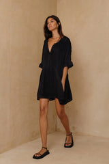Feminine mini dress featuring vintage-inspired pintuck detailing