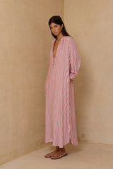 Relaxed striped maxi dress styled casually with sandals for warm-weather dressing