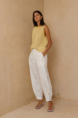 Mid-rise tailored cotton pants styled with a striped knit top