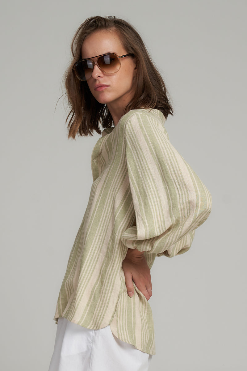 A Side View of a Green Stripe Cotton Top by LILYA