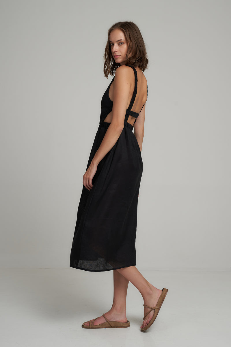 A Model Wearing a Black Linen Midi Dress with Cut Outs