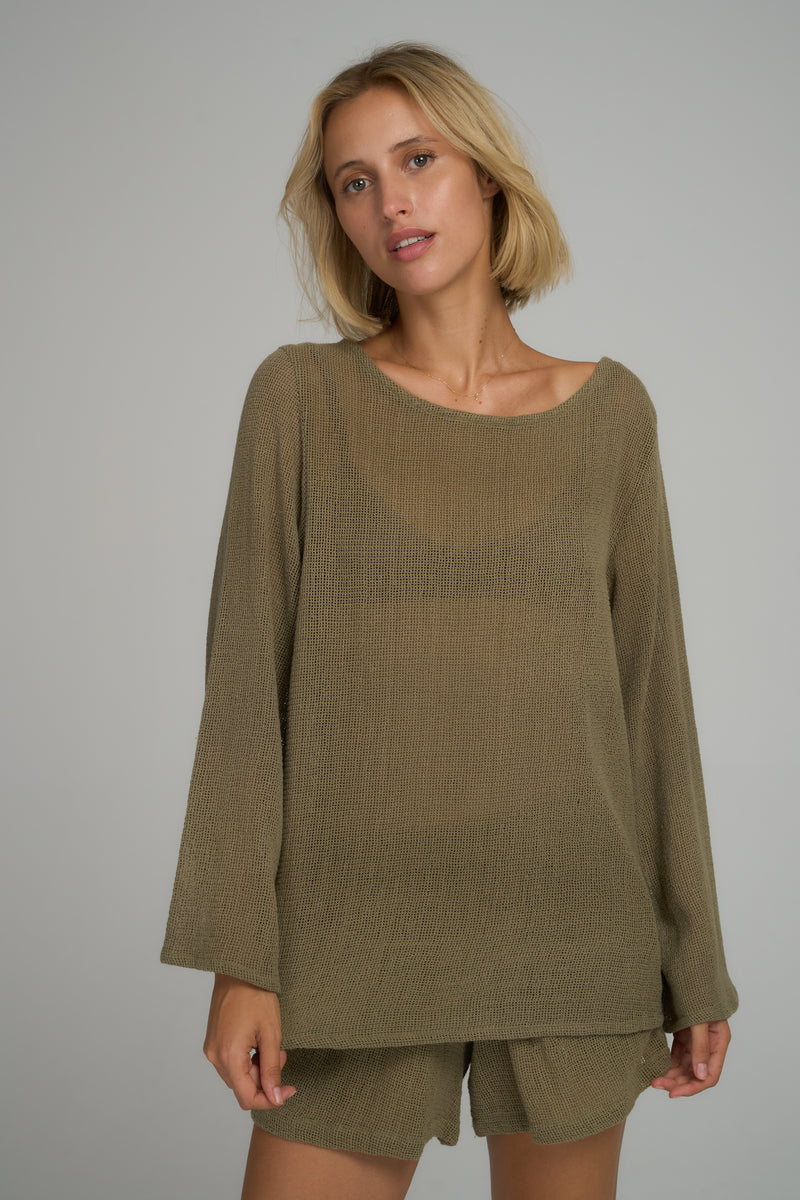 A model wearing a khaki cotton mesh casual top