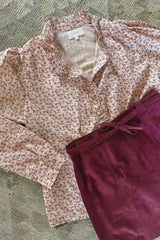 Floral blouse by LILYA with button up front and a suede skirt
