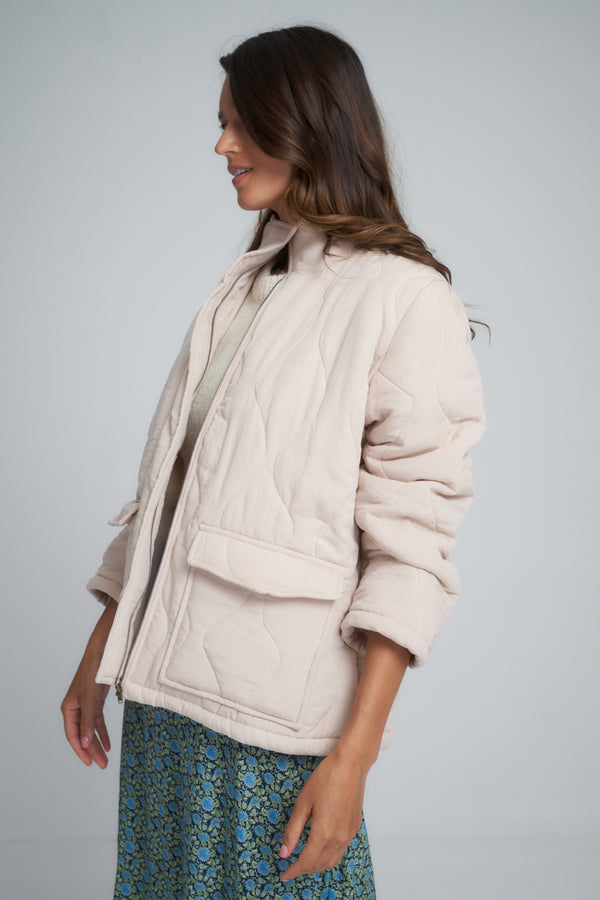 Side view of a light pink jacket in Australia