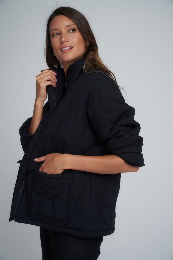A model wearing a classic black cotton jacket