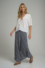 A model wearing a navy and white maxi skirt