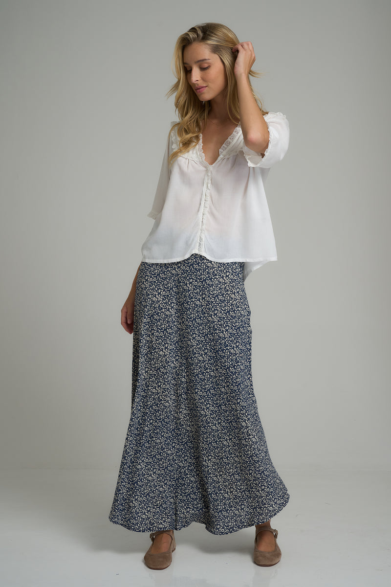 A model wearing a maxi floral skirt for winter