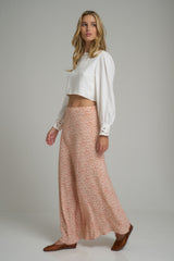 A woman wearing a floral maxi dress by LILYA